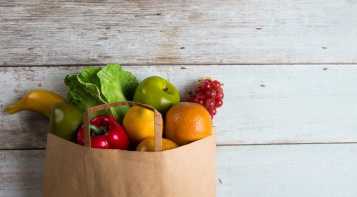 Grocery bag full of healthy foods for meal planning