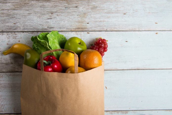 Grocery bag full of healthy foods for meal planning