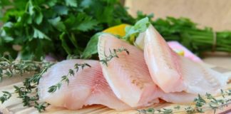 Healthy fish fillets on chopping board