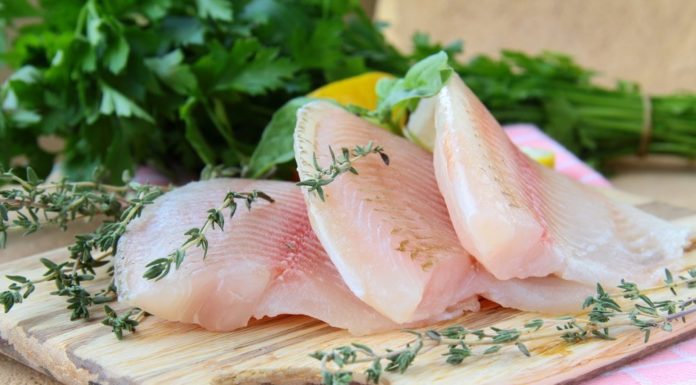 Healthy fish fillets on chopping board