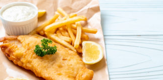 Fish and chips with tartar sauce and lemon slices