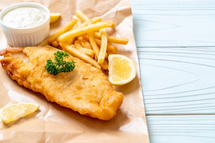 Fish and chips with tartar sauce and lemon slices