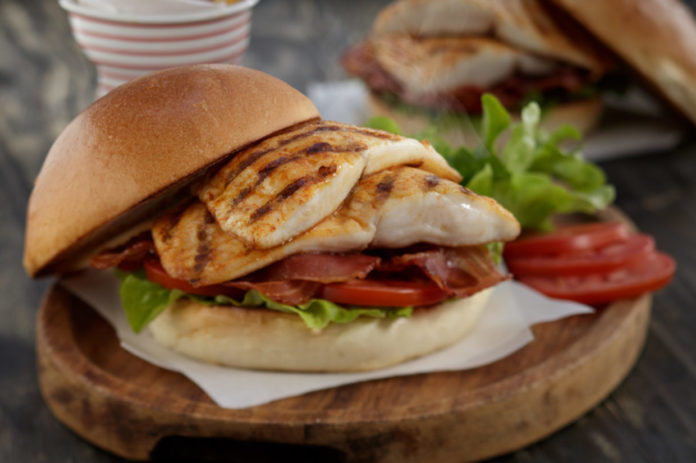 Grilled Tilapia sandwich with bacon, lettuce, and tomato