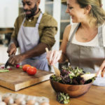 Couple prepping food in kitchen together