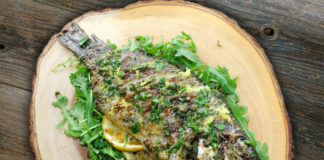 Grilled whole Tilapia with lemon butter and caper sauce
