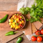 Fresh tomato-mango salsa with ingredients