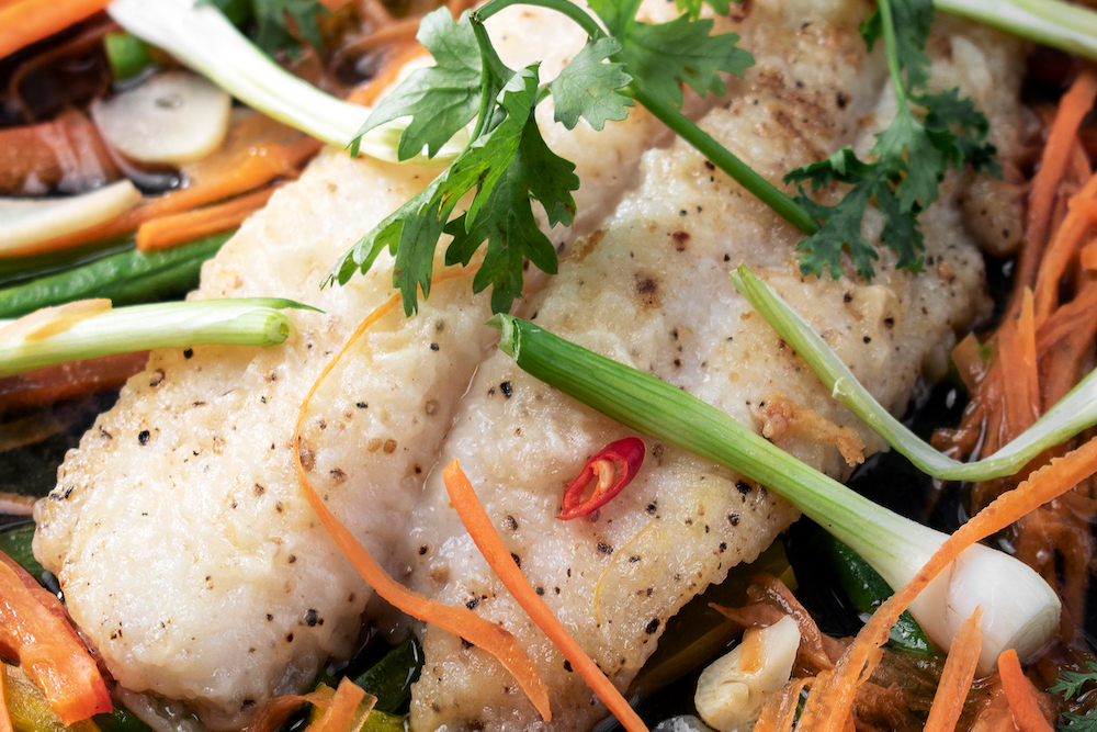 Cantonese-style steamed fish with vegetables