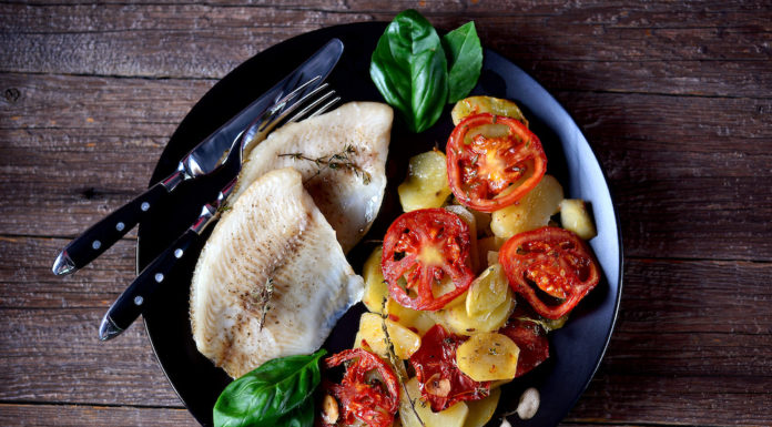 Baked Tialpia with roasted potatoes and tomatoes, garlic and thyme